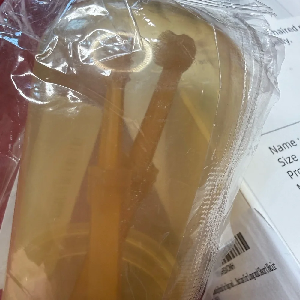 Orange and Gray Grooming Brush